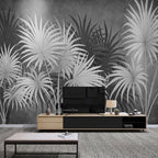 Papier peint panoramique Palmes noir et blanc : palmes noir et blanc sur le mur d'un séjour, au-dessus d'un meuble bas
