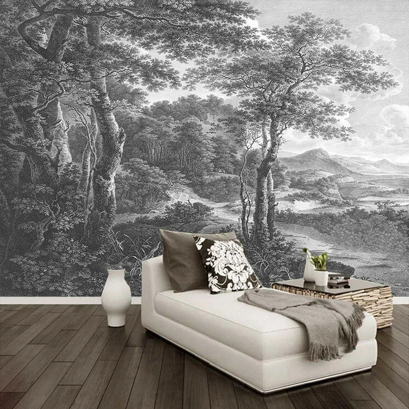 Papier peint panoramique Forêt ancienne noir et blanc : sous-bois gravé en noir et blanc, grands arbres et vallée, posé dans un salon