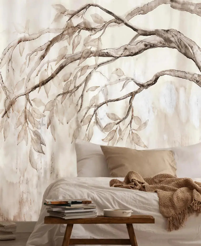 Papier peint panoramique Branches retombantes aquarelle sépia : branches retombantes à l'aquarelle sépia derrière un lit aux coussins lin et un banc en bois