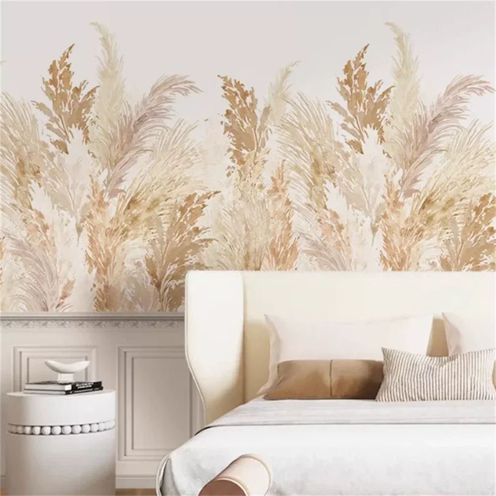 Papier peint panoramique Pampas et roseaux sable : herbes de la pampa et roseaux beige et sable sur fond crème, posé dans une chambre