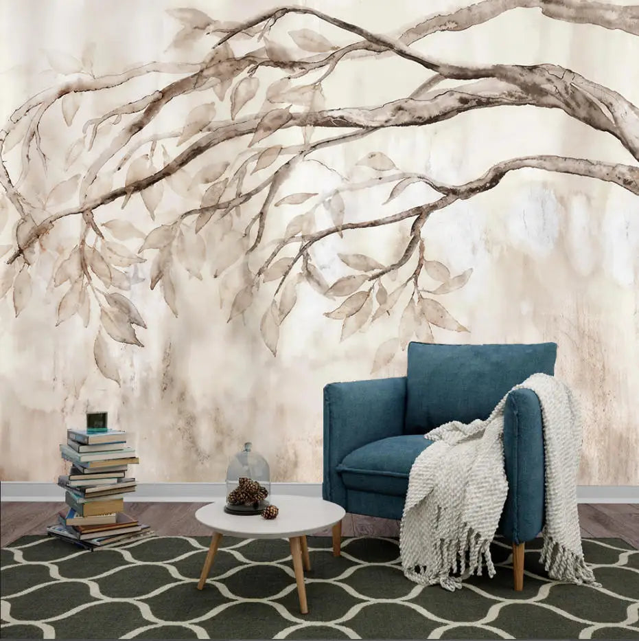 Papier peint panoramique Branches retombantes aquarelle sépia : branches retombantes à l'aquarelle sépia derrière un fauteuil bleu canard et une table basse blanche