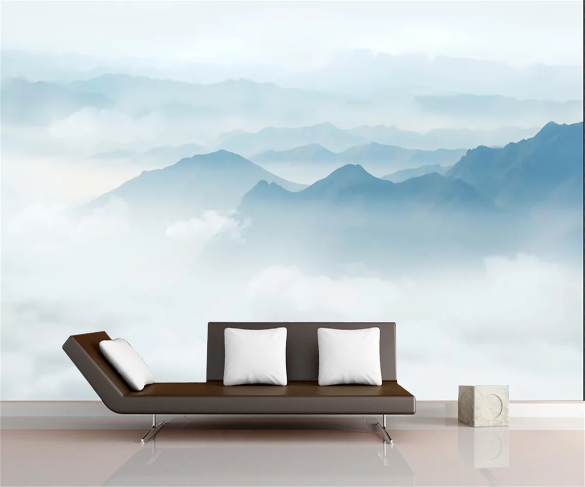Papier peint panoramique Crêtes bleu brume : crêtes bleu pâle au-dessus d'une mer de nuages, posé dans un salon