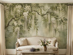 Papier peint panoramique Grand arbre fleuri vert sauge : grand arbre aux grappes de fleurs blanches sur fond vert sauge patiné, posé dans un salon