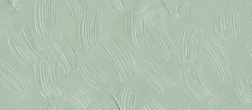 Papier peint effet plâtre peigné vert sauge : vue du motif, plâtre vert sauge travaillé en larges coups de peigne