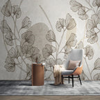 Papier peint panoramique Feuilles de ginkgo et formes sable : feuilles de ginkgo et formes sable près d'un fauteuil gris