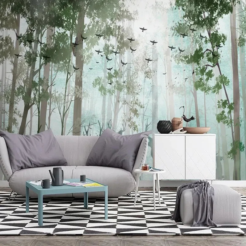 Papier peint panoramique Forêt aquarelle vert d'eau et cerfs : forêt aquarelle vert d'eau derrière un canapé gris