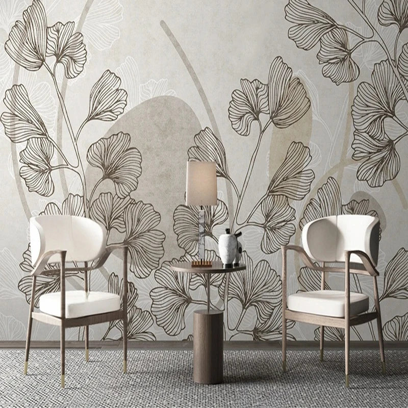 Papier peint panoramique Feuilles de ginkgo et formes sable : feuilles de ginkgo et formes sable derrière deux fauteuils