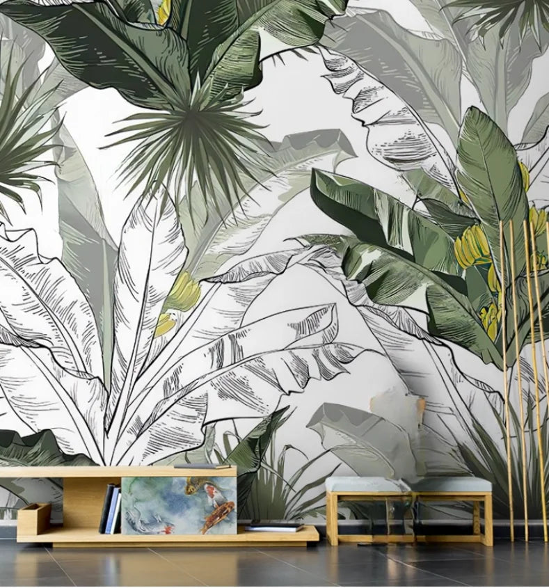 Papier peint panoramique Jungle esquissée noir et blanc : bananiers esquissés au trait noir, touches de vert, posé dans une pièce à vivre