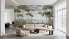 Papier peint panoramique Pins parasols peints vert sauge : pins parasols peints vert sauge sur tout le mur d'un grand salon lumineux, canapé et table basse en bois
