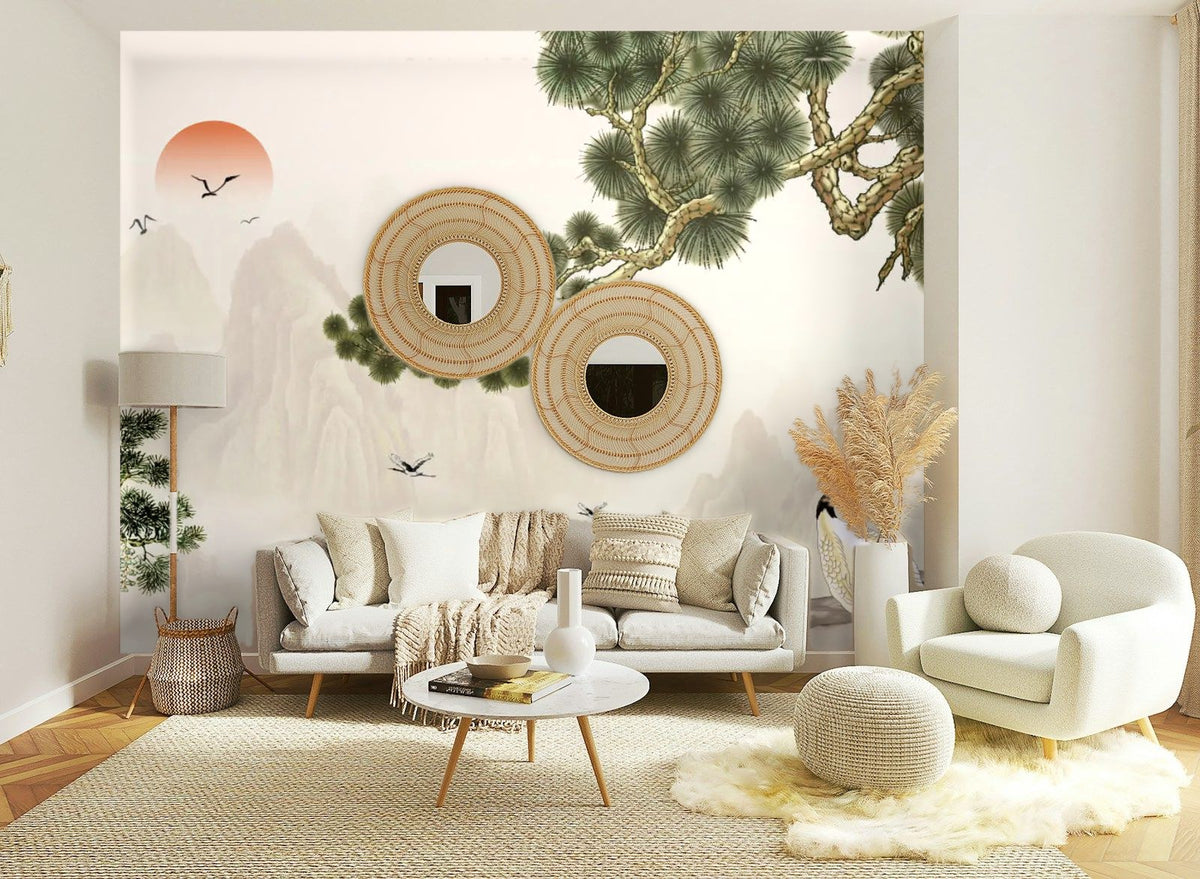 Papier peint panoramique Chinoiserie pins et grues sable posé sur le mur d’un salon clair