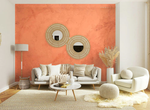 Papier peint effet enduit terre cuite posé sur le mur d’un salon clair