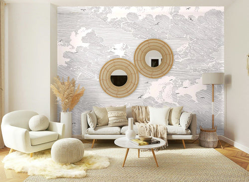 Papier peint effet nuages gravés gris rosé posé sur le mur d’un salon