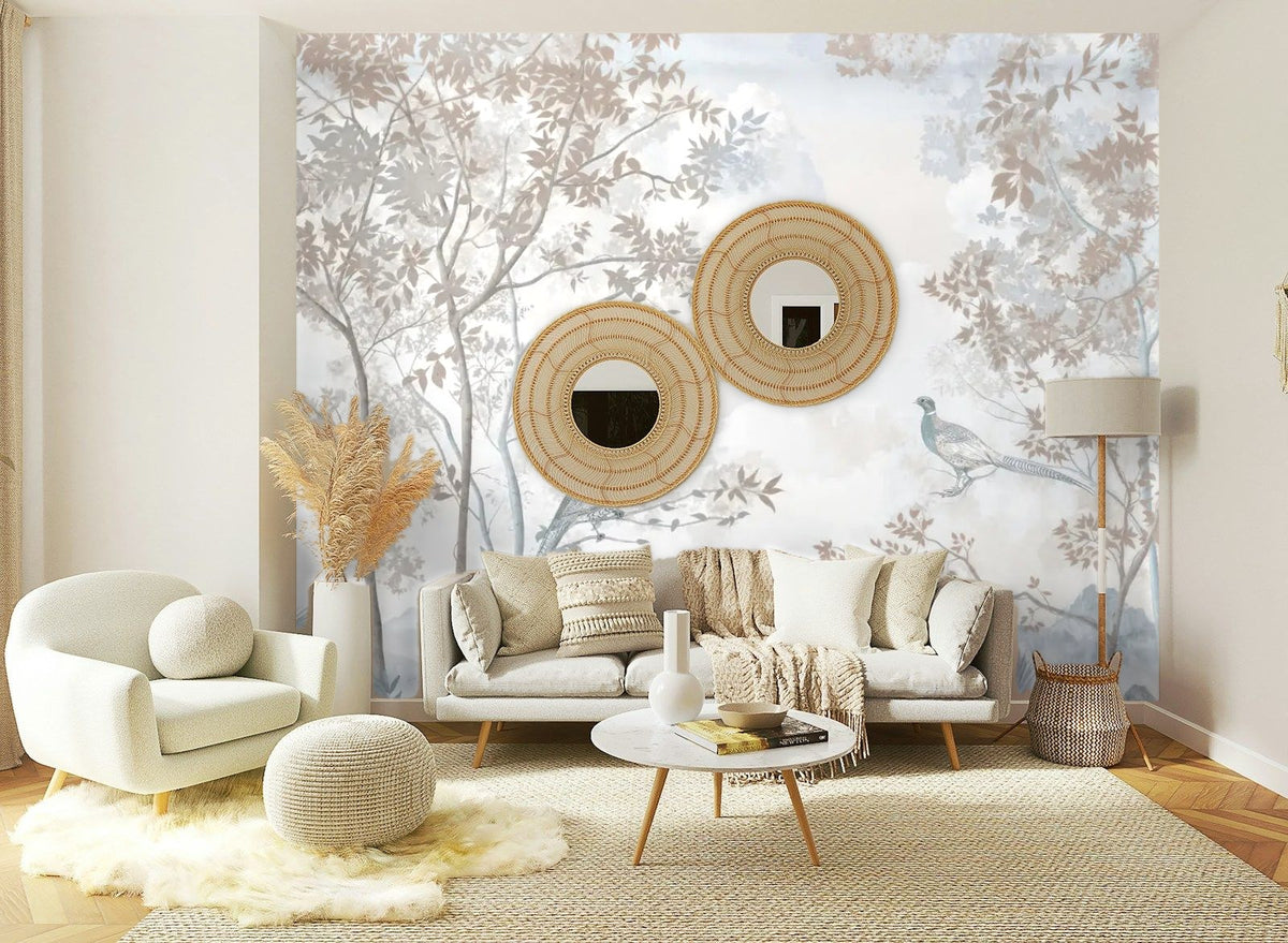 Papier peint panoramique Faisans et arbres bleu brume posé sur le mur d’un salon