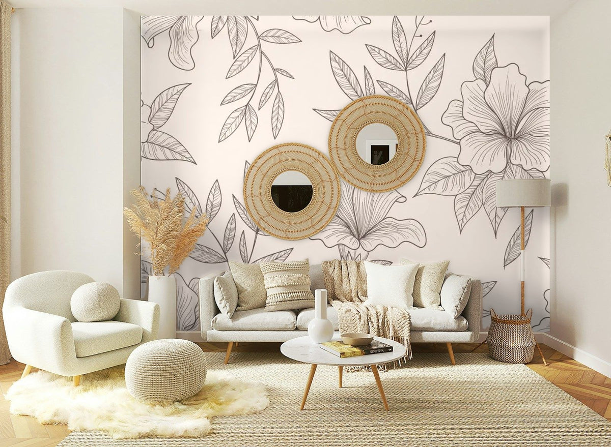 Papier peint panoramique Grandes fleurs au trait rose poudré posé sur le mur d’un salon