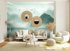 Papier peint panoramique Lac de montagne vert d'eau aux oiseaux posé sur le mur d’un salon clair
