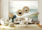 Papier peint panoramique Maison sur la colline dans la brume posé sur le mur d’un salon