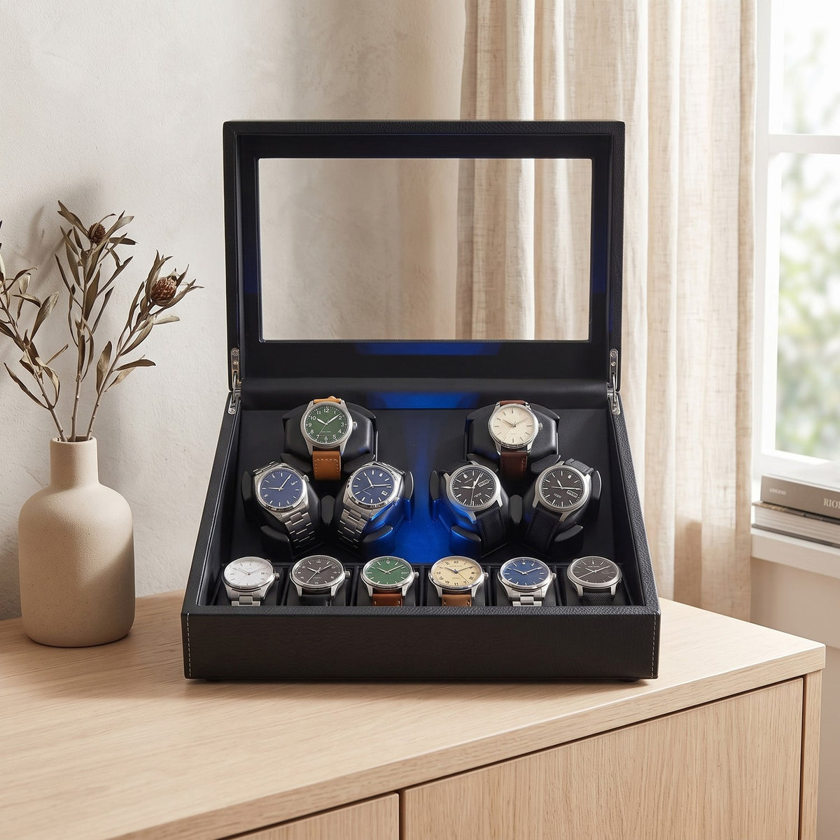 Remontoir Guilloché 6 + 6 montres, posé sur un buffet en chêne clair
