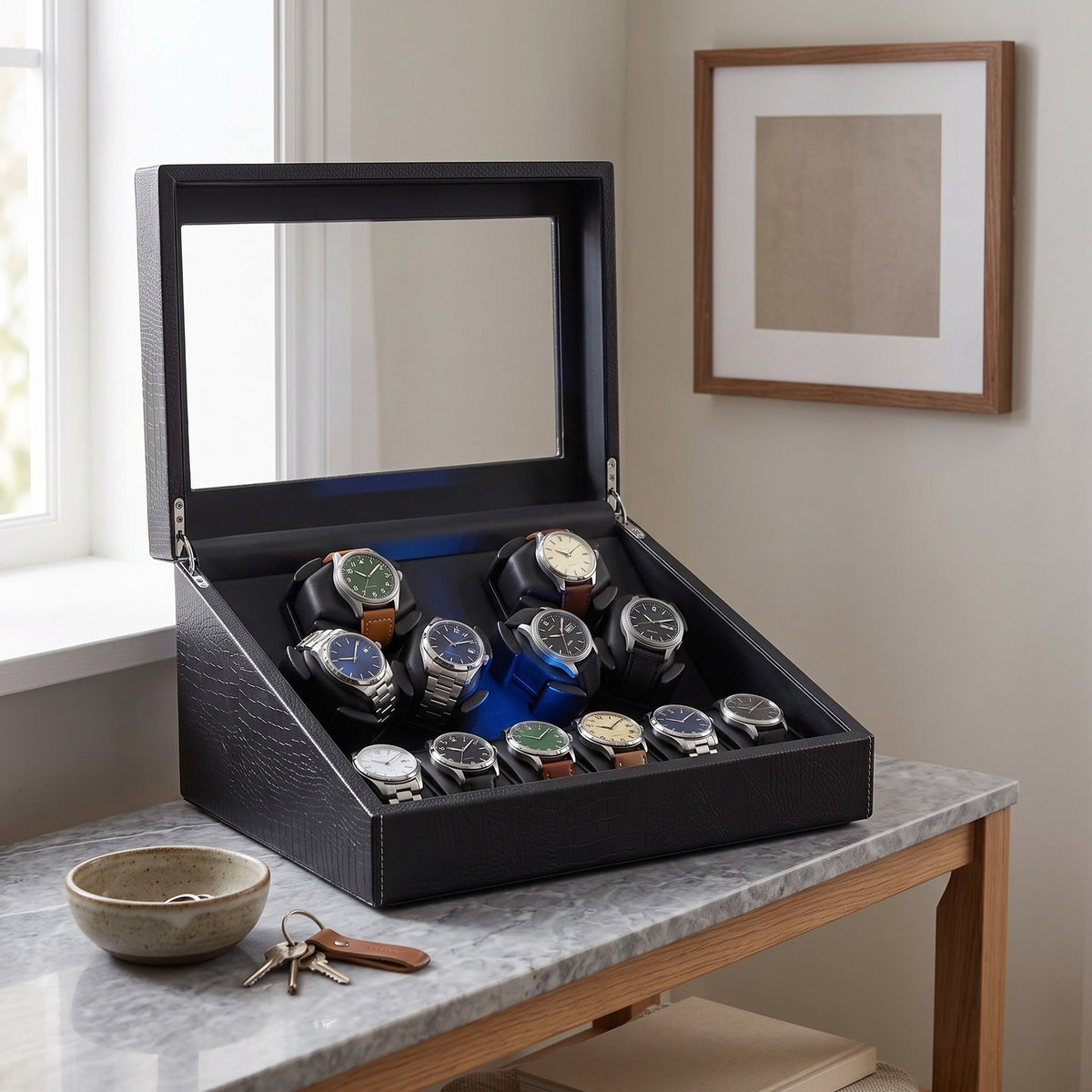 Remontoir Guilloché 6 + 6 montres, posé sur une console d'entrée
