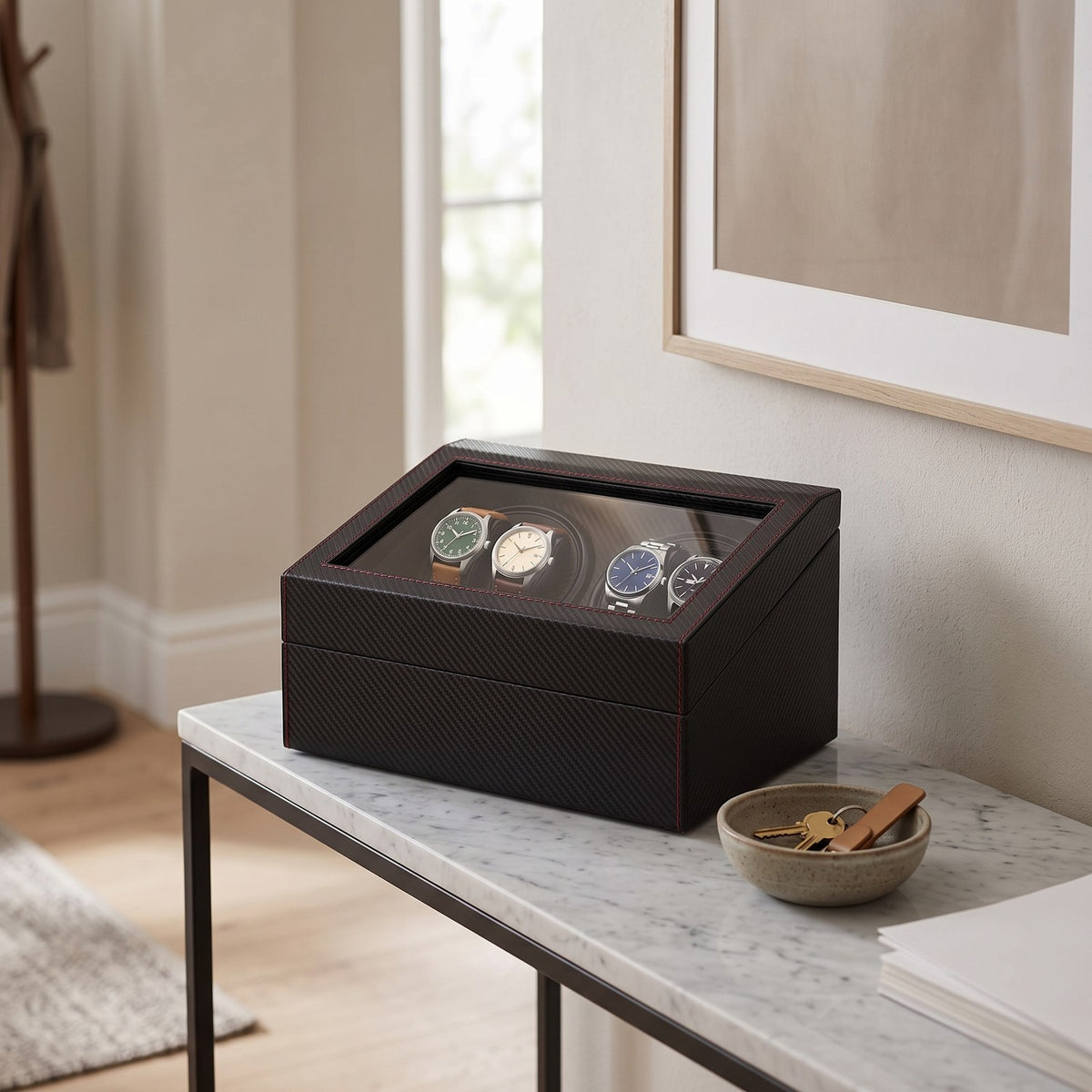 Remontoir Pont 4 montres, posé sur une console d'entrée